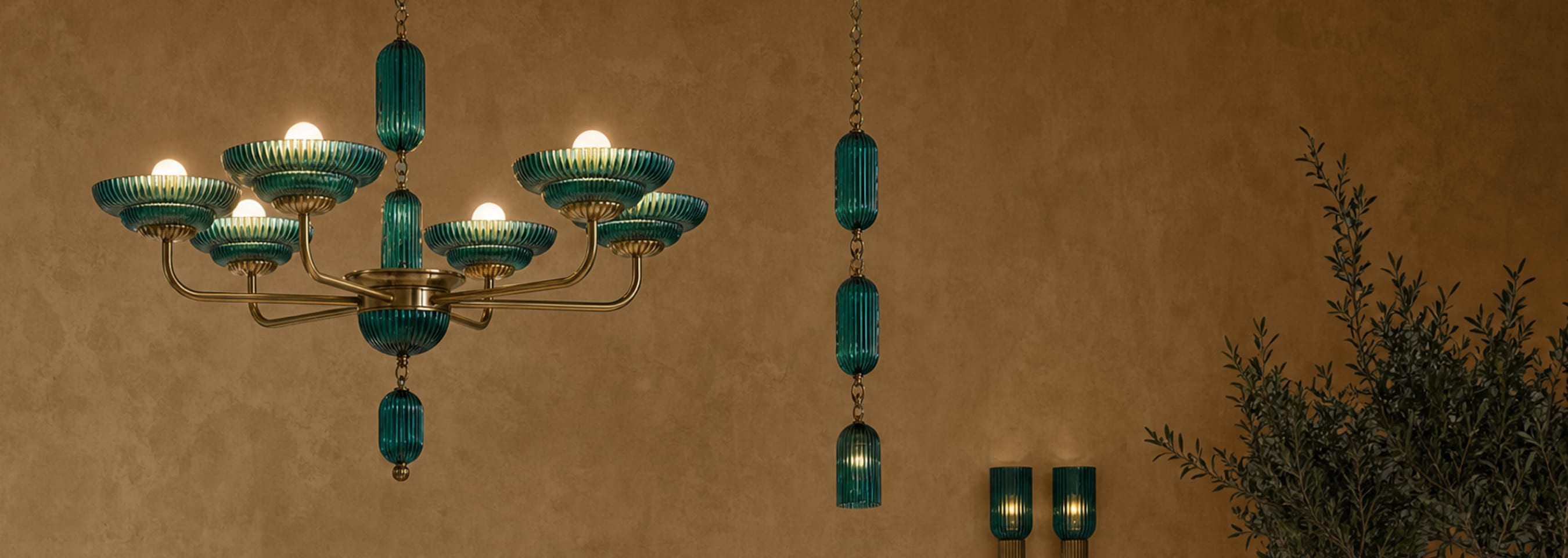 Sculptural green glass lighting with warm brass details